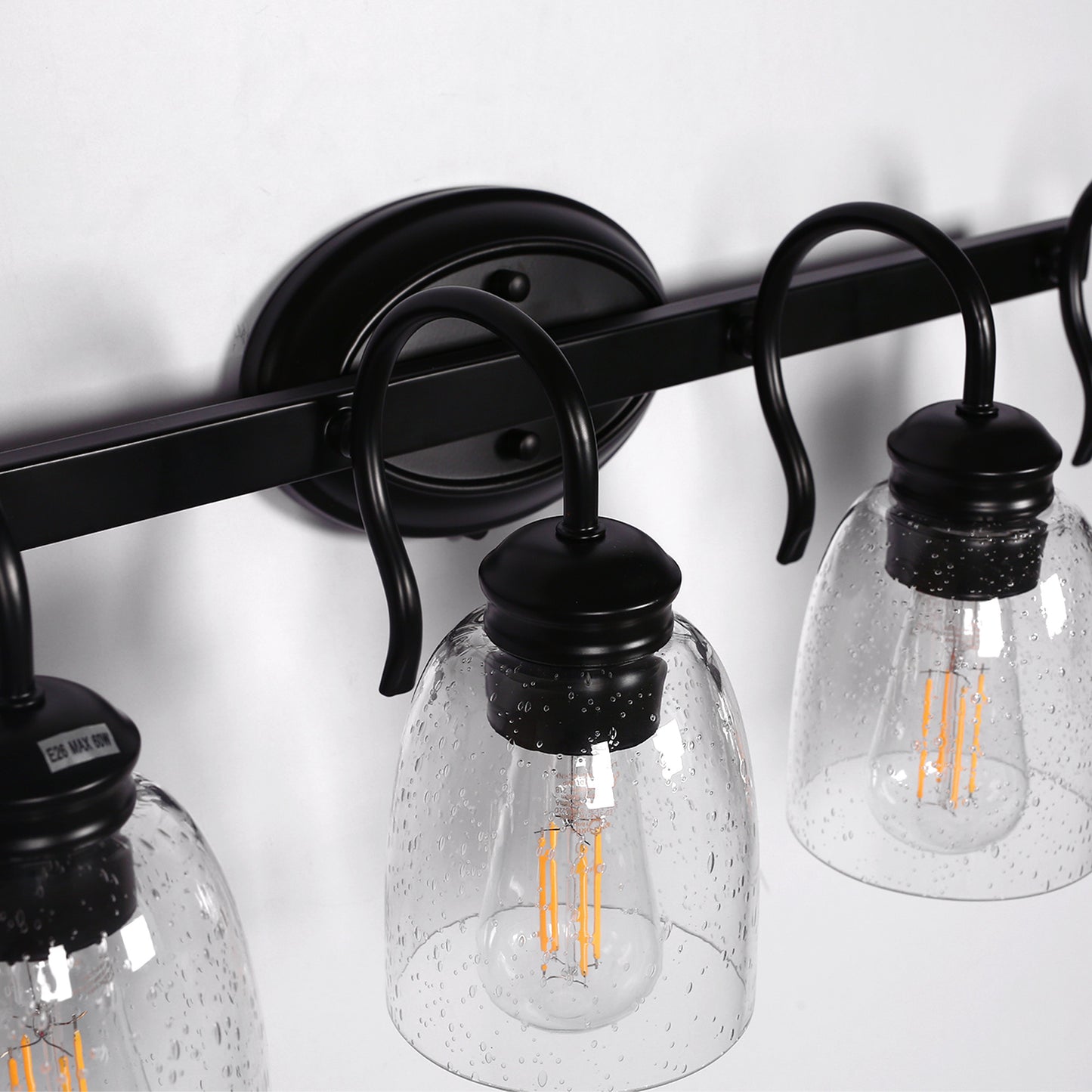 25.2 in. 4-Light Matte Black Modern Bathroom Vanity Light Mirror Wall Light with Black Accents and Seeded Glass Shade