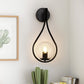 7.87 in. 1-Light Black Modern Globe Wall Sconce with Seeded Glass Shade for Living Room