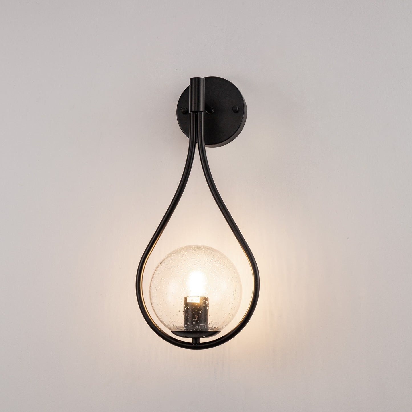 7.87 in. 1-Light Black Modern Globe Wall Sconce with Seeded Glass Shade for Living Room